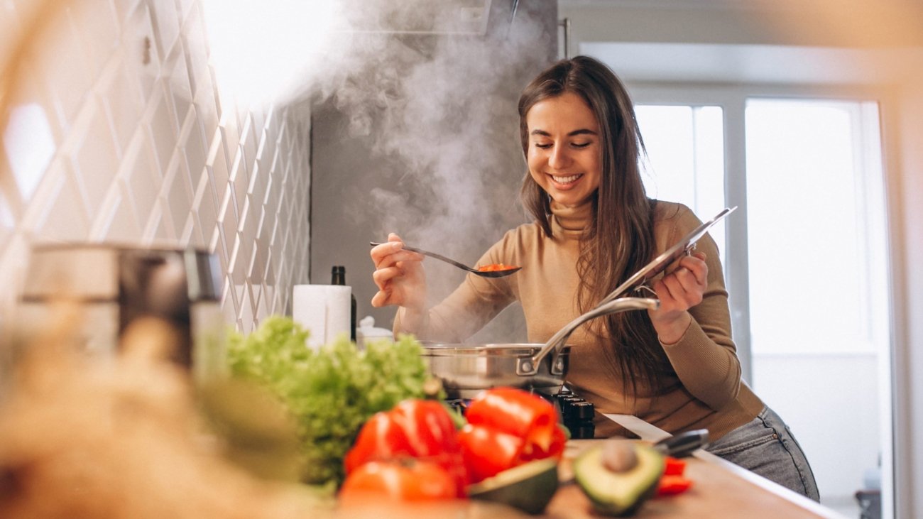 Woman cooking at kitchen